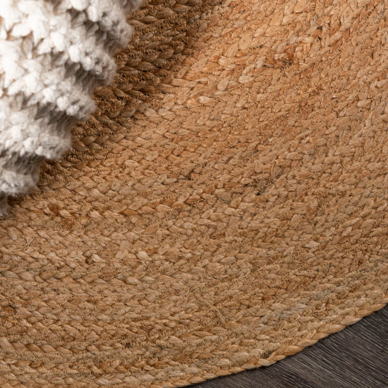 Natural round jute rug from above — handwoven India