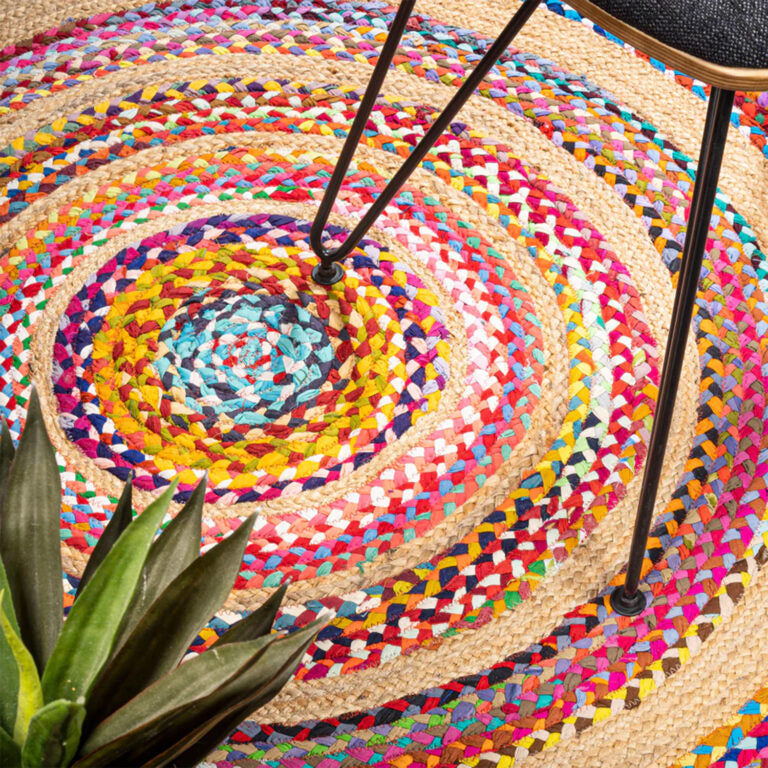 Colorful round jute rug from above — handwoven India