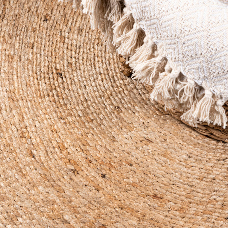 Natural round jute rug detail — artisan Indian craft