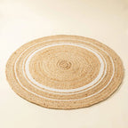 Brown and white round jute rug detail view — artisan India