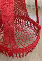 Red macrame rope swing chair
