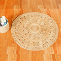 Brown floral braided jute rug room view — handwoven India