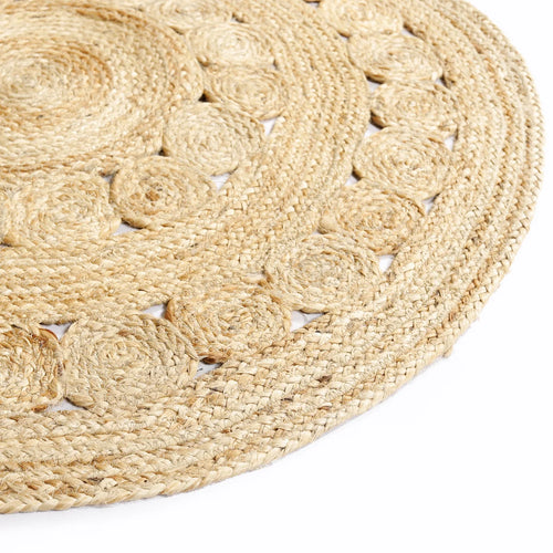 Brown floral braided jute rug close-up detail — natural fibre India