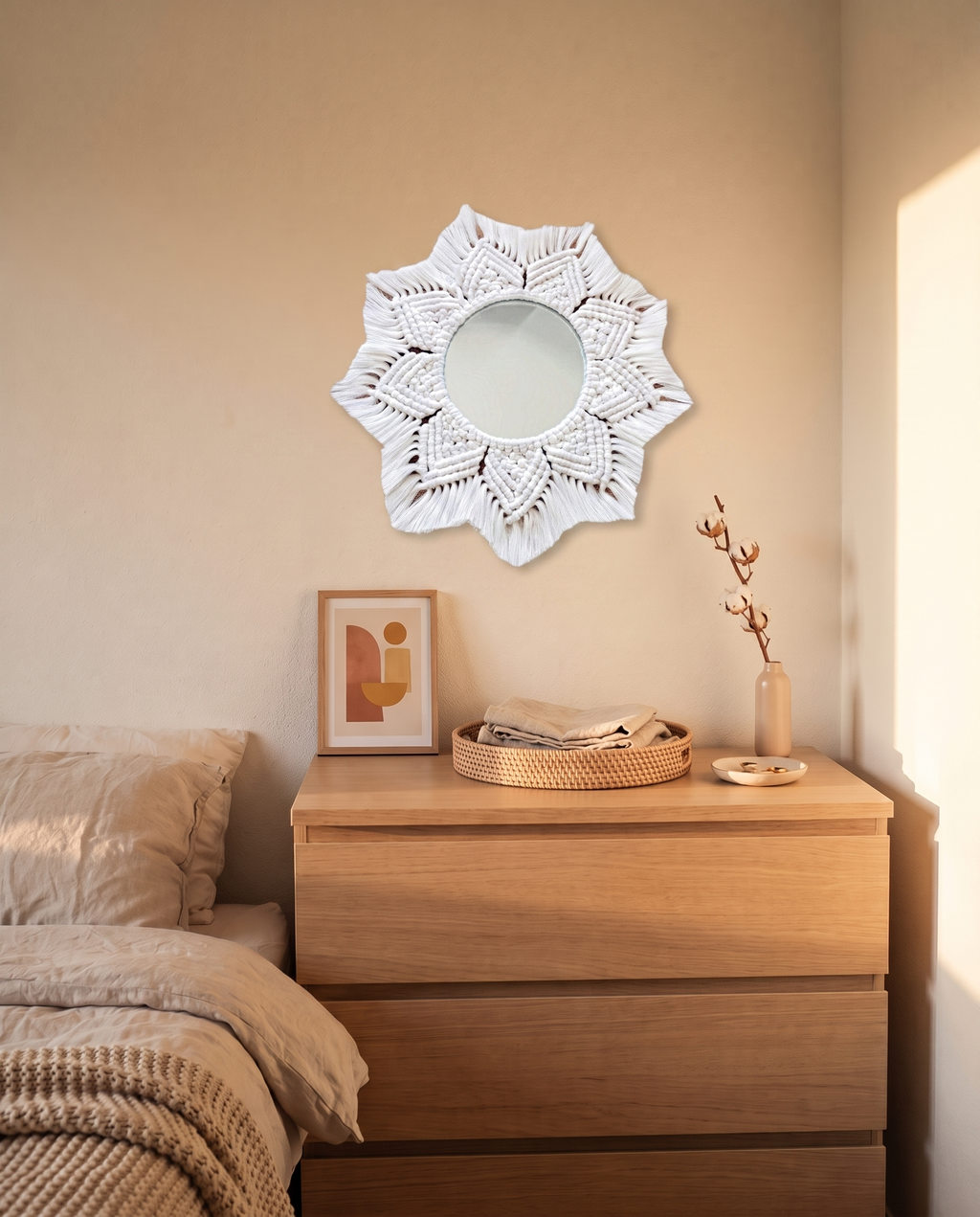 Magnolia floral macrame wall mirror hung above a bedroom dresser