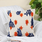 Abstract tasseled hand-tufted cushion cover styled on a sofa