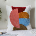 Abstract geometric circles hand-tufted cushion cover styled on a sofa