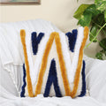 Chevron zigzag hand-tufted cushion cover styled on a sofa