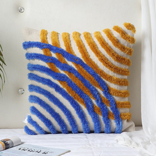 Abstract tufted cushion cover styled on a sofa