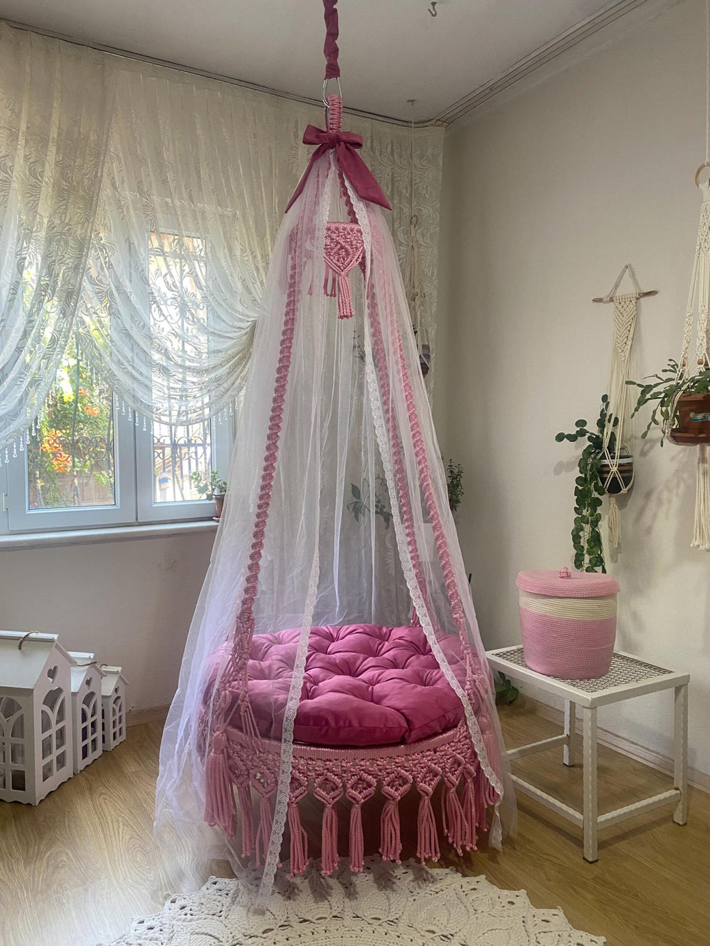 Luxurious macrame swing bed with canopy
