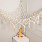 White macrame toy hammock net weave detail