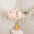 White macrame toy hammock with wooden beads