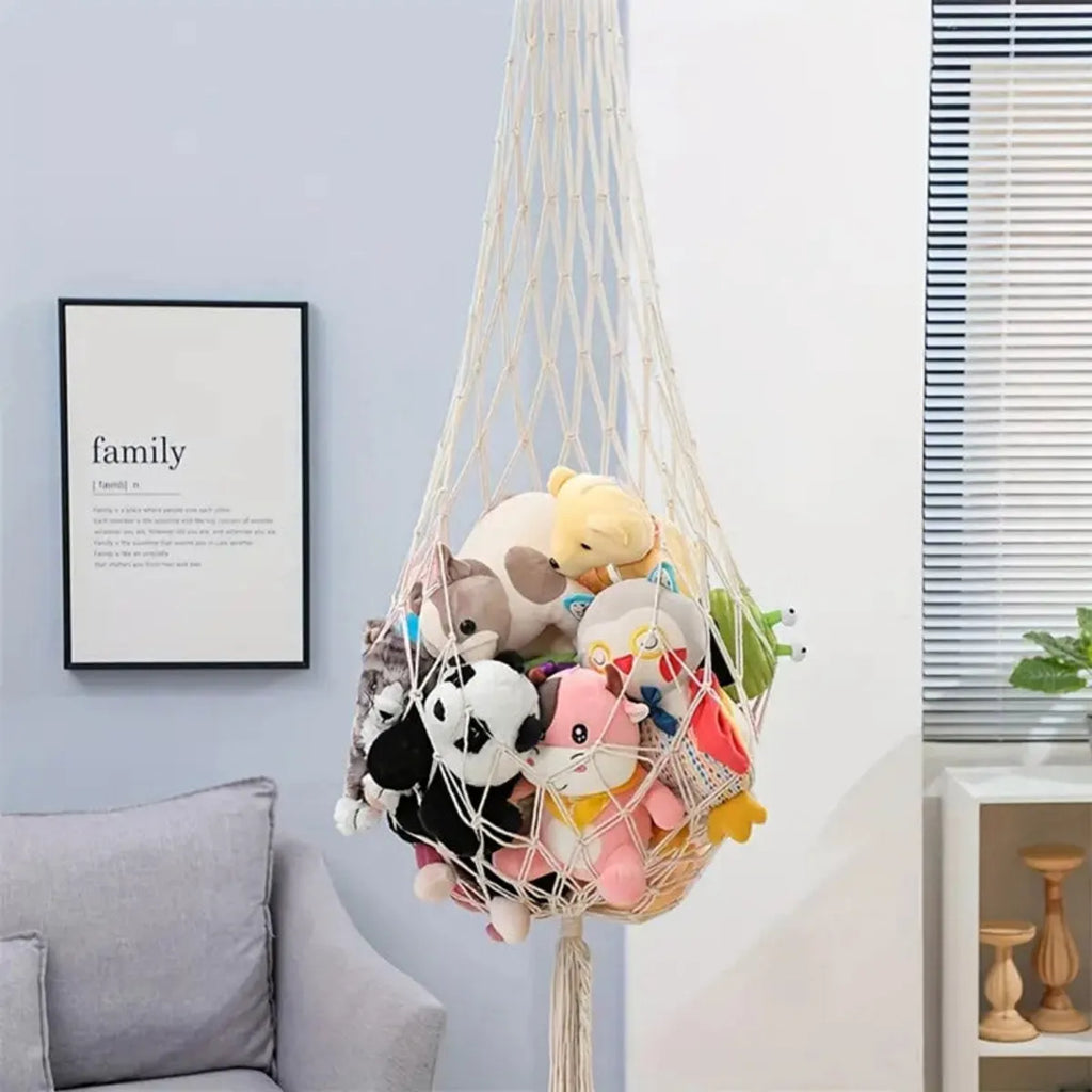 Ivory macrame toy hammock holding stuffed animals